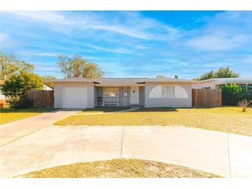 Cute ranch home with a large yard, driveway, and attached garage at 2809 49Th N St, St Petersburg, FL 33710