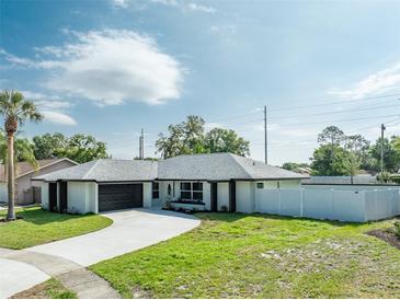 Newly renovated home with modern exterior and driveway at 734 Fortuna Dr, Brandon, FL 33511