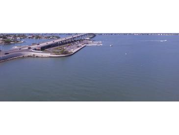 Aerial view of bridge, water, and roadway at 100 Bluff View Dr # 401A, Belleair Bluffs, FL 33770
