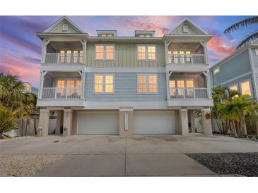 Three-story beach house with three-car garage and balconies at 16317 Gulf Blvd, Redington Beach, FL 33708