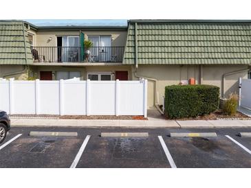 Exterior view of condo with parking and private entrance at 1799 N Highland Ave # 99, Clearwater, FL 33755