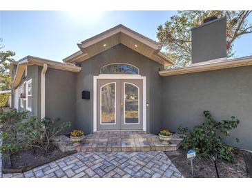 Charming front entrance with double doors, brick steps, and landscaped accents at 540 Villagrande S Ave, St Petersburg, FL 33707