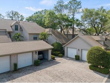 Attractive condo complex with garages and lush landscaping at 2824 Countryside Blvd # 326, Clearwater, FL 33761