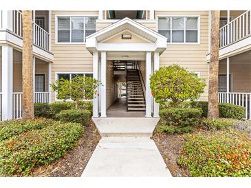 Condo building entrance with stairs and landscaping at 4802 51St W St # 224, Bradenton, FL 34210