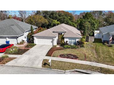 House's aerial view showcasing the property's location and surrounding neighborhood at 4251 Whittner Dr, Land O Lakes, FL 34639