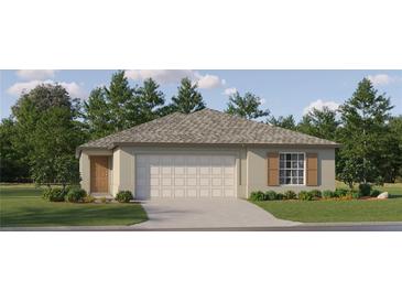 One-story house with a garage and landscaped lawn at 10199 Gentle Rain Dr, Land O Lakes, FL 34638