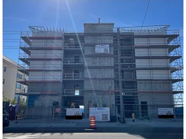 Multi-unit building under construction, featuring modern design and scaffolding at 14046 Gulf Blvd # 2, Madeira Beach, FL 33708