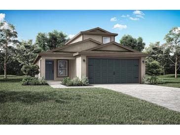 One-story house with a two-car garage and landscaped lawn at 29527 Fedora Cir, Brooksville, FL 34602