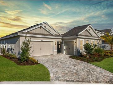 Beautiful two-story home with a three-car garage and landscaped yard at 33843 Galley Way, Wesley Chapel, FL 33543