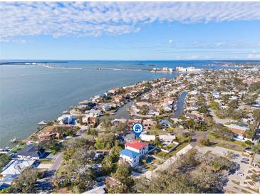 Aerial view of waterfront home with private dock and boat lift at 1964 Cedar Dr, Dunedin, FL 34698