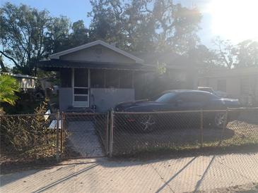 One-story house with a front yard and driveway at 3019 E Louisiana Ave, Tampa, FL 33610