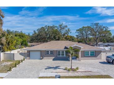 Newly renovated home with a large driveway and fenced yard at 659 Keene Rd, Largo, FL 33771