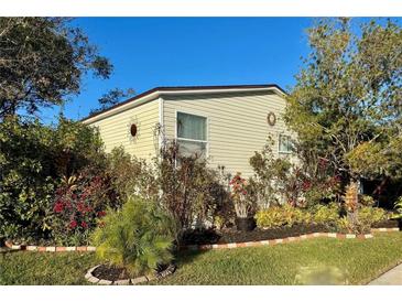 Well-maintained manufactured home with landscaping at 8326 Fantasia Park Way, Riverview, FL 33578