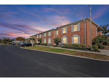 Brick building exterior at sunset with parking lot and landscaping at 3824 37Th S St # 67, St Petersburg, FL 33711