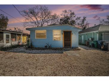 Light blue house with a small front yard at 4603 Webster St, Tampa, FL 33610