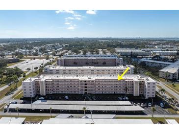 Aerial view of a residential building complex, showcasing its size and layout at 5623 80Th N St # 505, St Petersburg, FL 33709