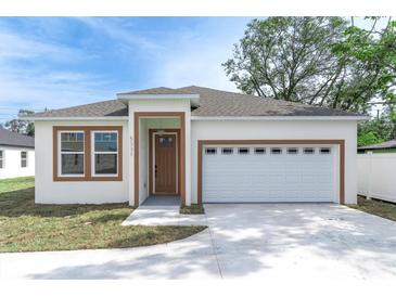 Beautiful home featuring a two-car garage, well-maintained landscaping, and a charming covered entry at 5331 71St N Way, St Petersburg, FL 33709