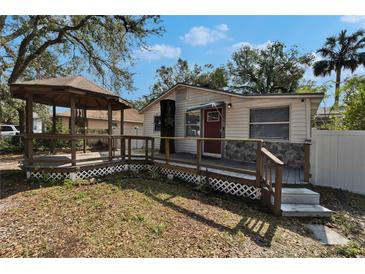 Cute bungalow with a gazebo and deck at 3005 E Shadowlawn Ave, Tampa, FL 33610