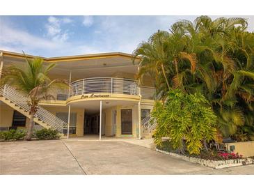 Inviting two-story condo complex featuring lush tropical landscaping and covered parking at 145 10Th N Ave # 8, St Petersburg, FL 33701