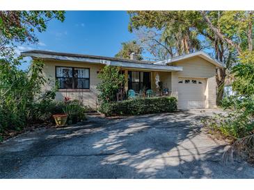 Charming single Gathering home with a nicely manicured lawn and attached one car garage at 3512 Haines N Rd, St Petersburg, FL 33704