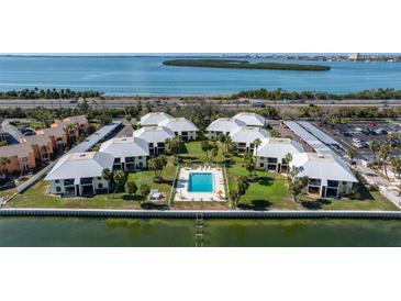 Waterfront condo community with a shared pool and views of the bay, perfect for relaxed coastal living at 7300 Sunshine Skyway S Ln # 202, St Petersburg, FL 33711