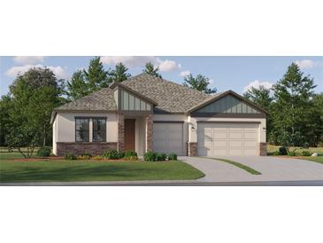 Charming single-story home features a two-car garage, manicured lawn, and stylish stone accents at 6841 E 115Th St, Palmetto, FL 34221