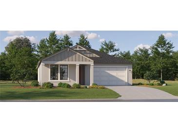 Charming one-story home featuring a gray exterior, manicured lawn, and attached two-car garage at 7529 E 116Th St, Palmetto, FL 34221