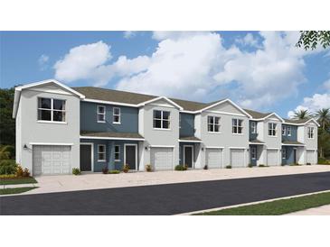 View of the new two-story townhomes featuring attached garages and contemporary design at 2744 Newbern Banks Dr, Bradenton, FL 34208