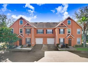 Charming townhome with well-manicured landscaping and attached garage at 9142 Lake Chase Island Way # 9142, Tampa, FL 33626