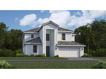 Charming two-story home with gray roof, light siding, and manicured lawn at 10574 Buttercup Ct, Venice, FL 34293