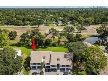 Charming two-story condos surrounded by lush greenery with serene pond views, offering a peaceful community setting at 2075 Lakewood Club S Dr # 6A, St Petersburg, FL 33712