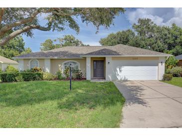 Charming single-story home with a well-manicured front yard and two-car garage at 2333 Appaloosa Cir, Sarasota, FL 34240