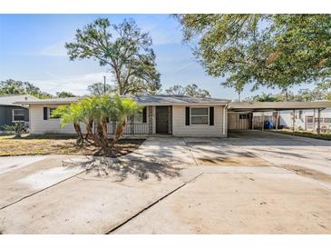 Charming single-story home with a well-manicured lawn and a covered carport at 5020 16Th N Ave, St Petersburg, FL 33710