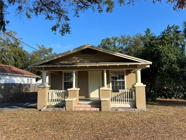 Charming bungalow featuring a cozy front porch, perfect for enjoying the outdoors at 101 W Fern St, Tampa, FL 33604