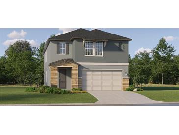 Two-story house with gray siding, stone accents, and a two-car garage at 11559 E 71St Ter, Palmetto, FL 34221