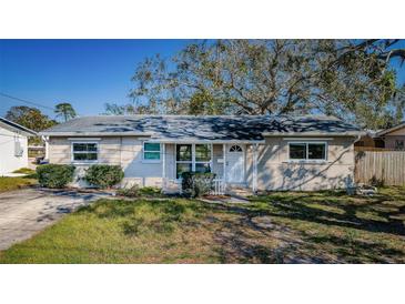 Charming single-story home featuring a well-maintained lawn, inviting entrance, and neutral exterior paint at 4601 Carson Ne St, St Petersburg, FL 33703