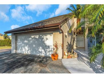 Charming home featuring a well-maintained two-car garage and a beautifully landscaped front yard at 4777 Duhme Rd # 1A, St Petersburg, FL 33708
