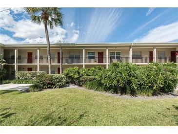 Inviting multi-Gathering exterior featuring a well-manicured lawn, mature landscaping, and a classic facade at 2207 S Carolina Ave # 16, Tampa, FL 33629