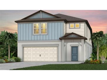 Two-story home with blue and white siding, a two-car garage, and a charming front entry at 6714 Michael Favor Way, Wesley Chapel, FL 33545