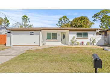 Charming single-story home with a well-maintained lawn and inviting front entrance at 10925 124Th Ave, Largo, FL 33778