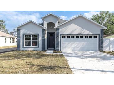 Charming single-Gathering home with an attached garage and freshly cut lawn at 5341 71St N Way, St Petersburg, FL 33709