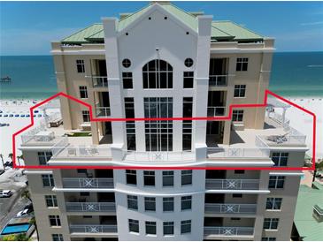 Exterior view of building with multiple balconies overlooking the ocean and beach at 10 Papaya St # 1404, Clearwater Beach, FL 33767