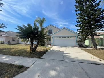 Charming single-Gathering home with a well-maintained lawn and two-car garage at 10127 Barnett Loop, Port Richey, FL 34668