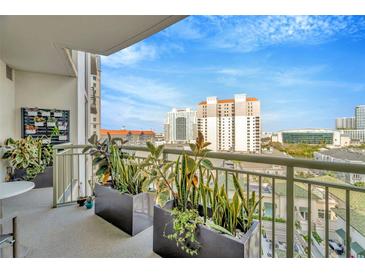 City views from this condo balcony, complete with potted plants, makes a relaxing outdoor oasis at 450 Knights Run Ave # 1005, Tampa, FL 33602