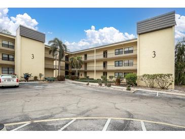 Well-maintained condo building with ample parking and beautiful landscaping at 14130 Rosemary Ln # 3203, Largo, FL 33774