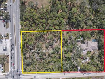 A bird's eye view shows a home with an additional 2.8 acres available for purchase next door at 3112 Desoto Rd, Sarasota, FL 34234