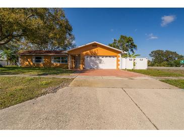 Charming single-story home with a two-car garage, driveway, and well-maintained front yard at 11351 130Th Ave, Largo, FL 33778