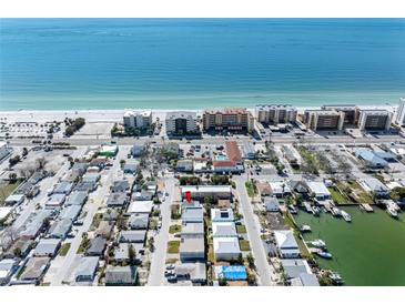 Breathtaking aerial view of beachside community with Gulf views and waterway access at 120 148Th E Ave, Madeira Beach, FL 33708