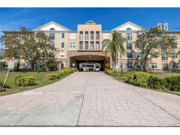 Attractive multi-story building with covered driveway access and well-maintained landscaping at 4221 W Spruce St # 1325, Tampa, FL 33607