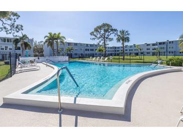 Community pool and lounge area at condo building in the sunshine at 4915 Bay Ne St # 322, St Petersburg, FL 33703